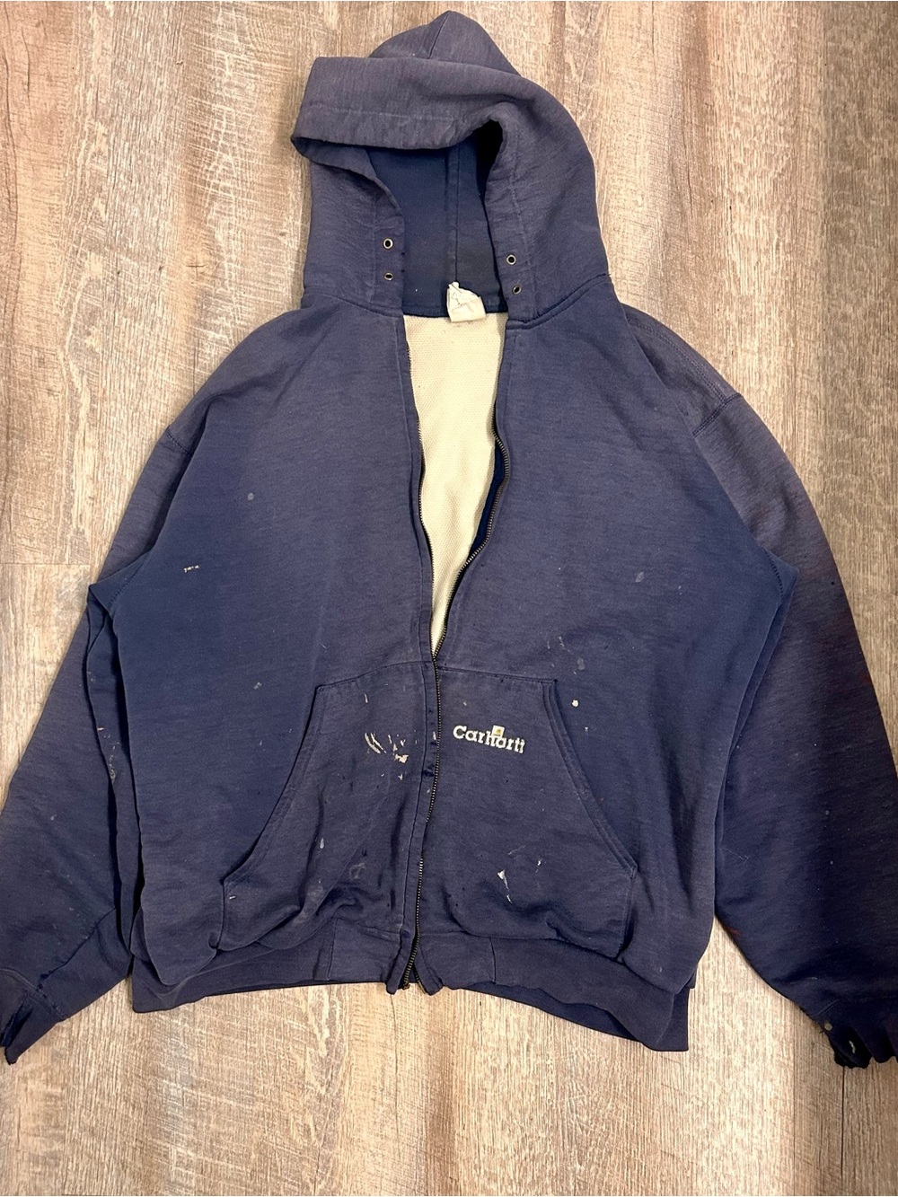 Carhartt Navy Hooded Zip Jacket very distressed with tears and holes. No zipper.